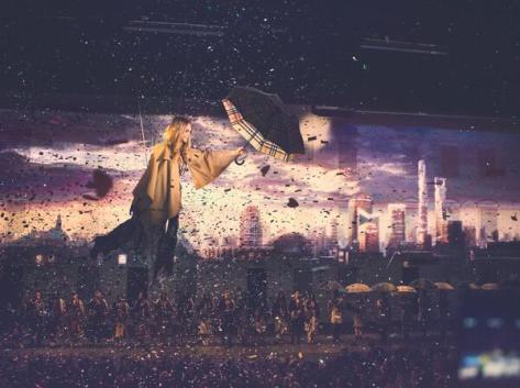 Cara Delevingne soars above the audience in a spectacular finale at the Burberry event in Shanghai - Executive Salad