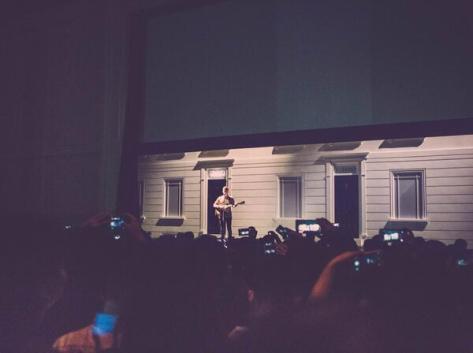 British musician George Ezra appears from the darkness to perform as Burberry celebrates in Shanghai - Executive Salad